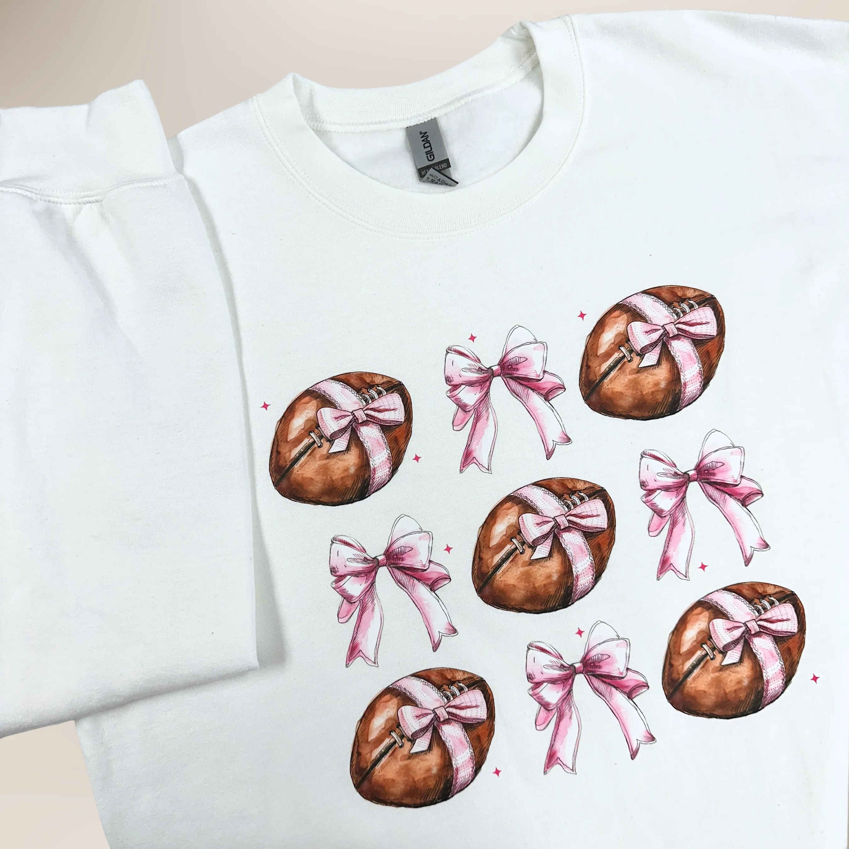 Girly Footballs With Bows on White Gildan Heavy Blend Sweatshirt